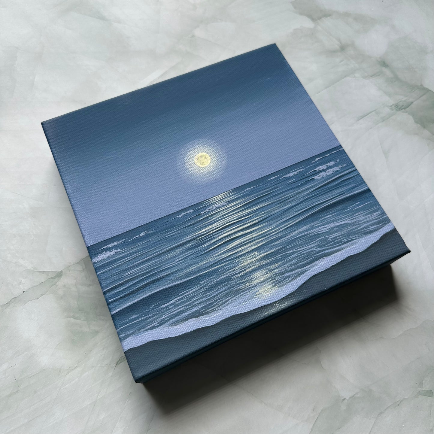 the ocean holds the moon