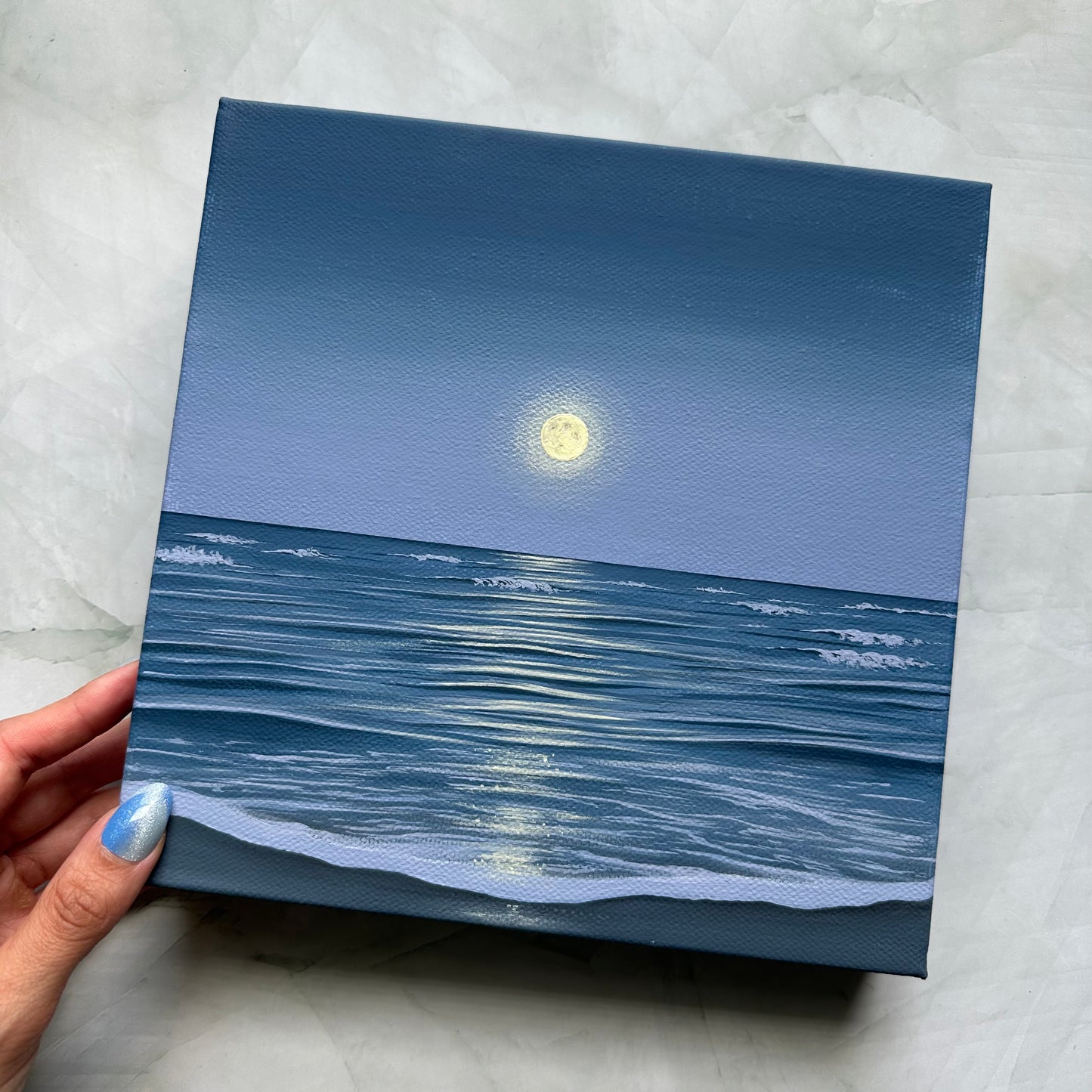 the ocean holds the moon