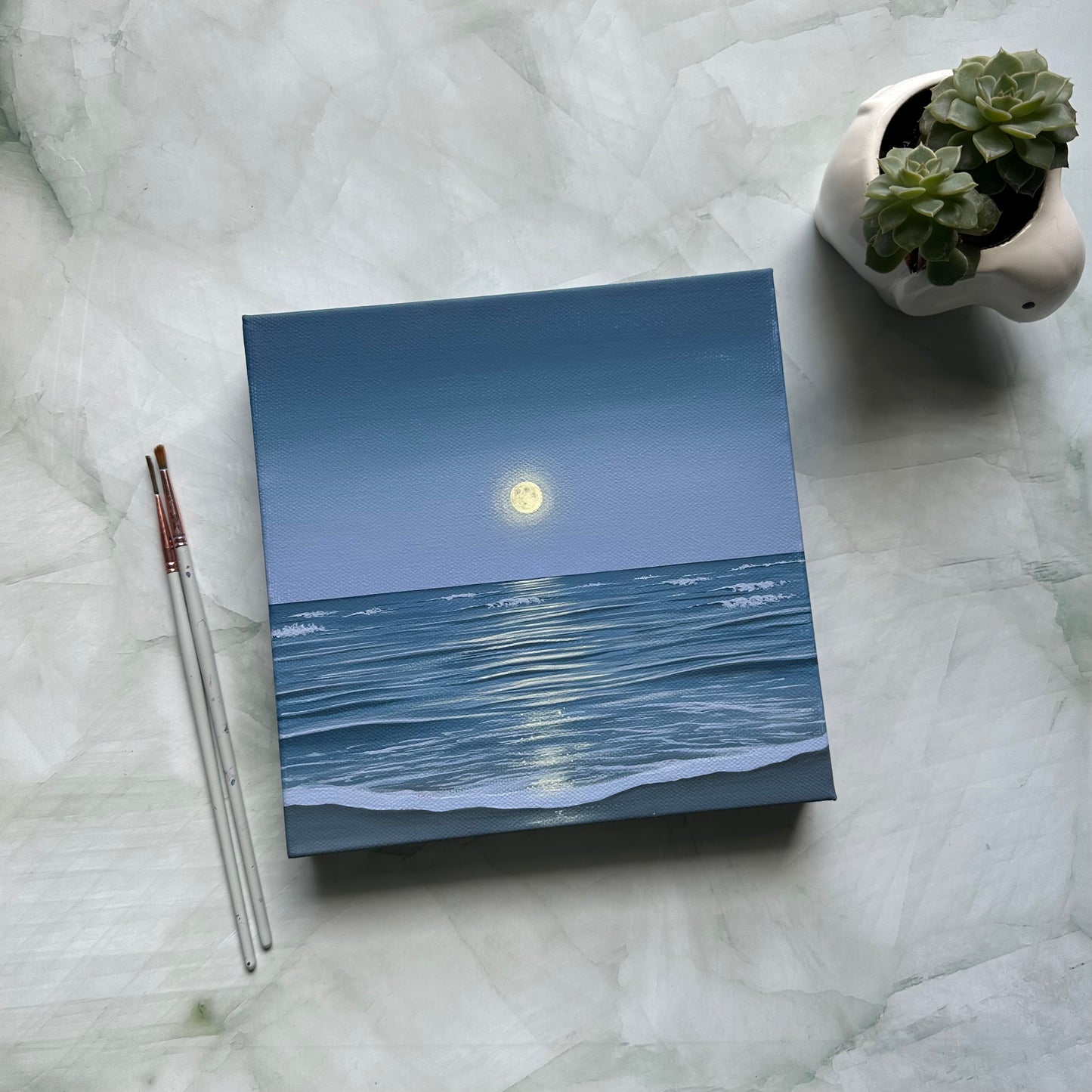 the ocean holds the moon