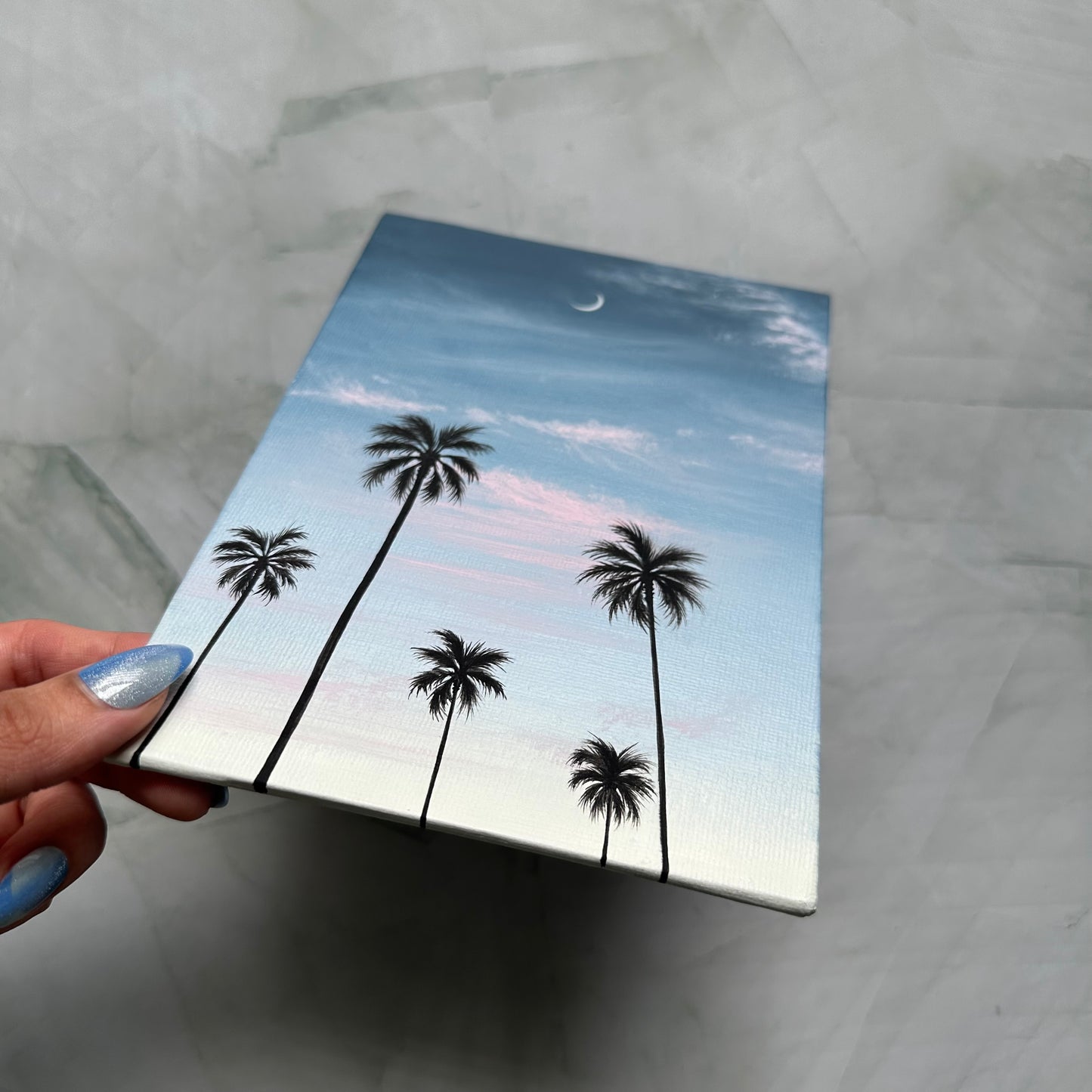 crescent over palms