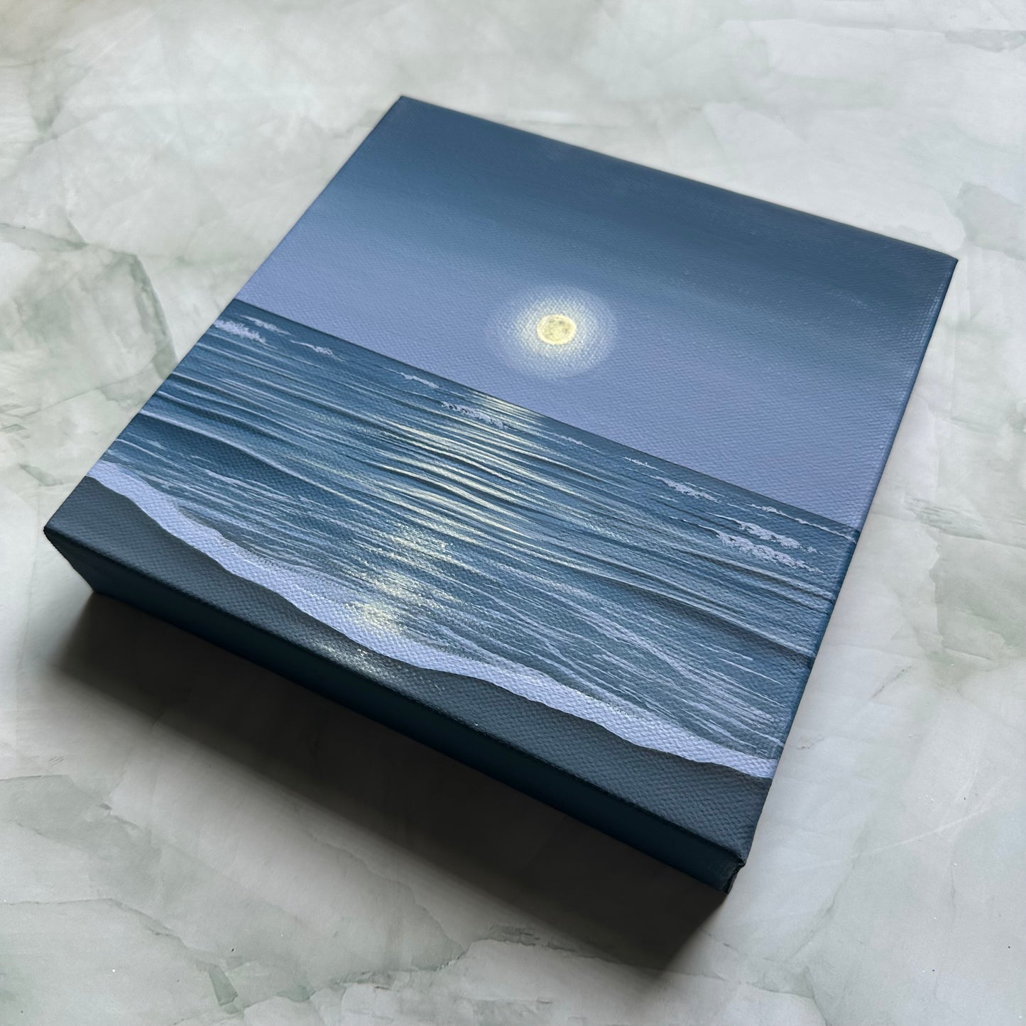the ocean holds the moon