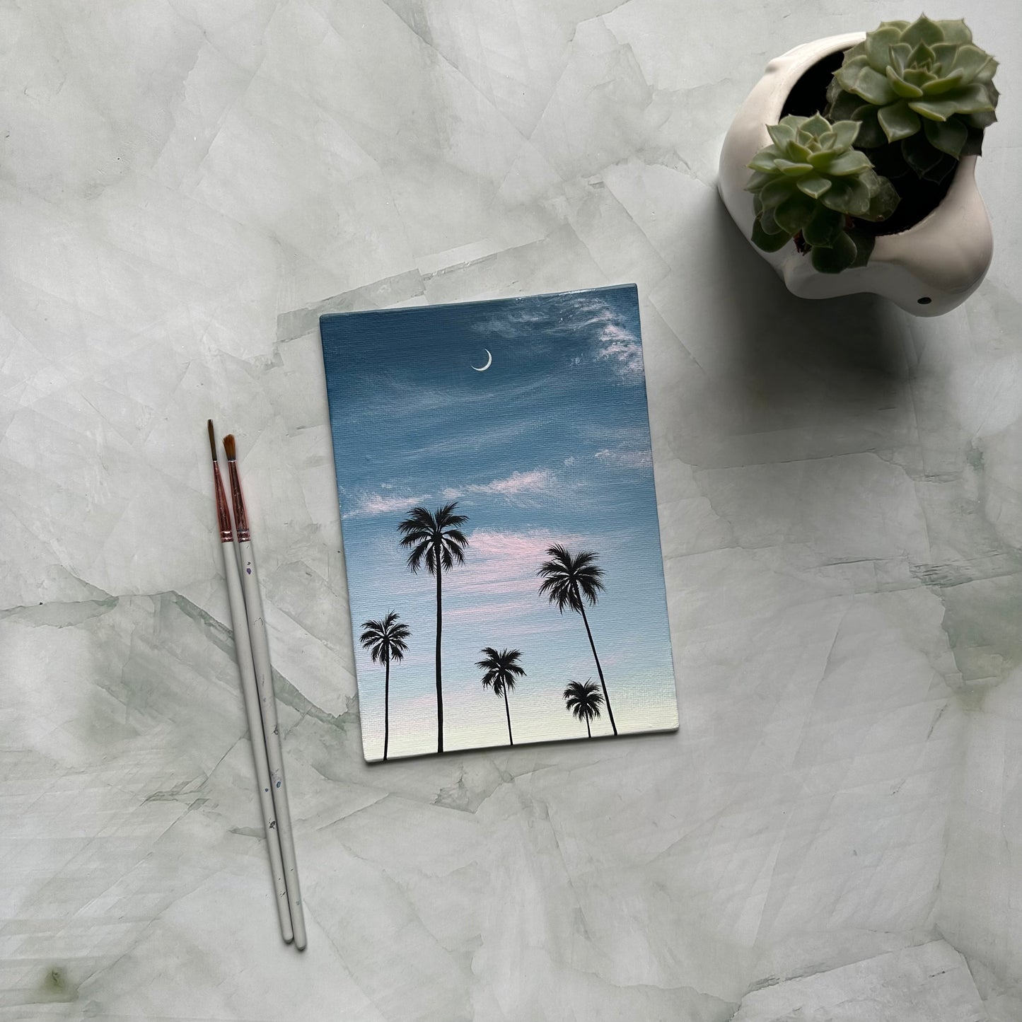 crescent over palms