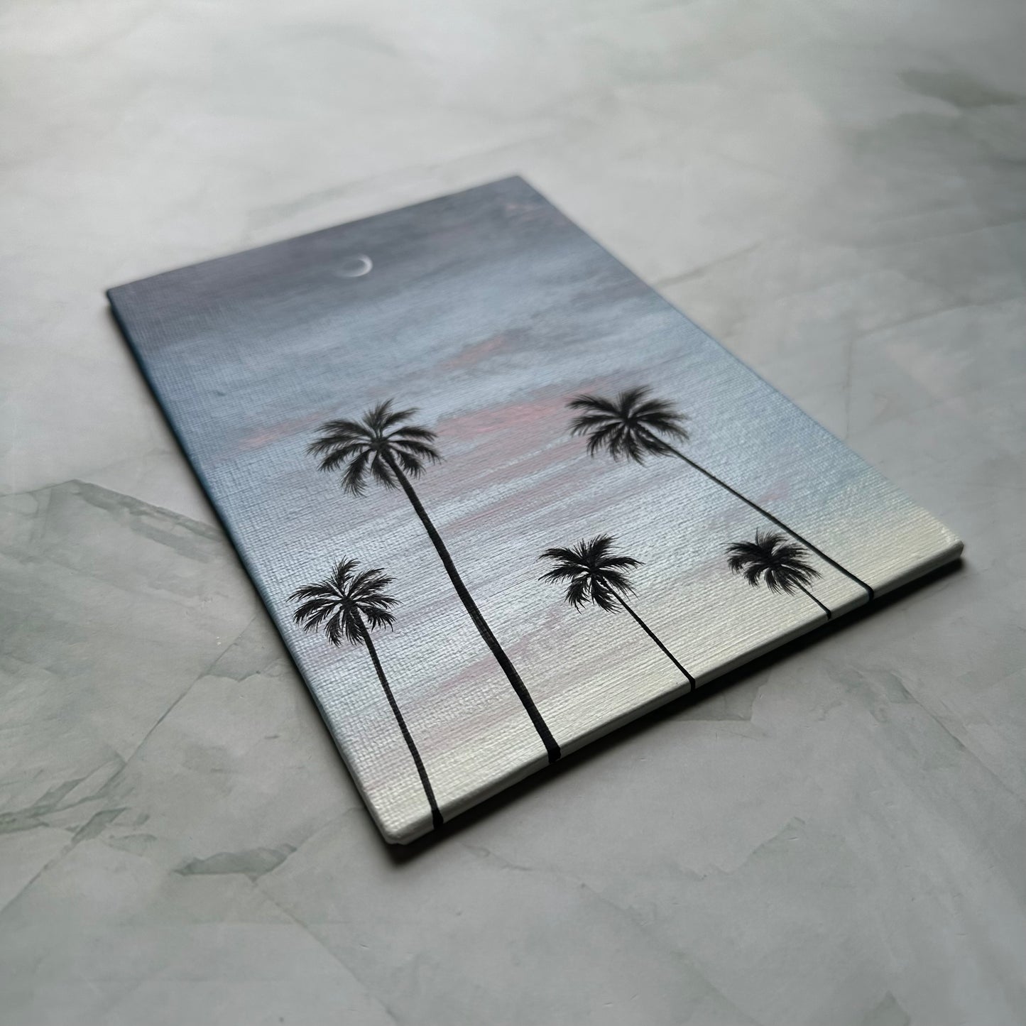crescent over palms