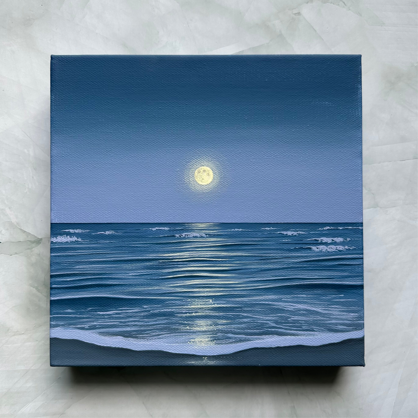 the ocean holds the moon
