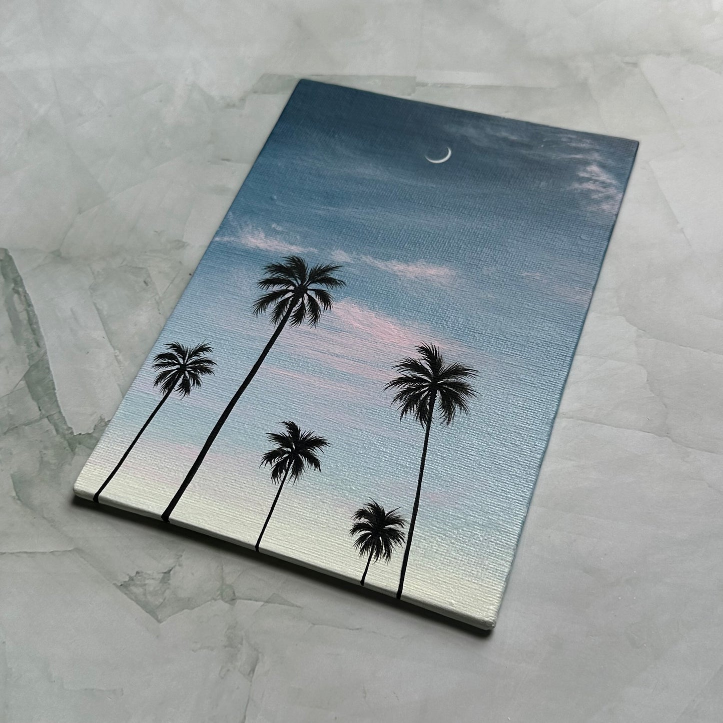 crescent over palms