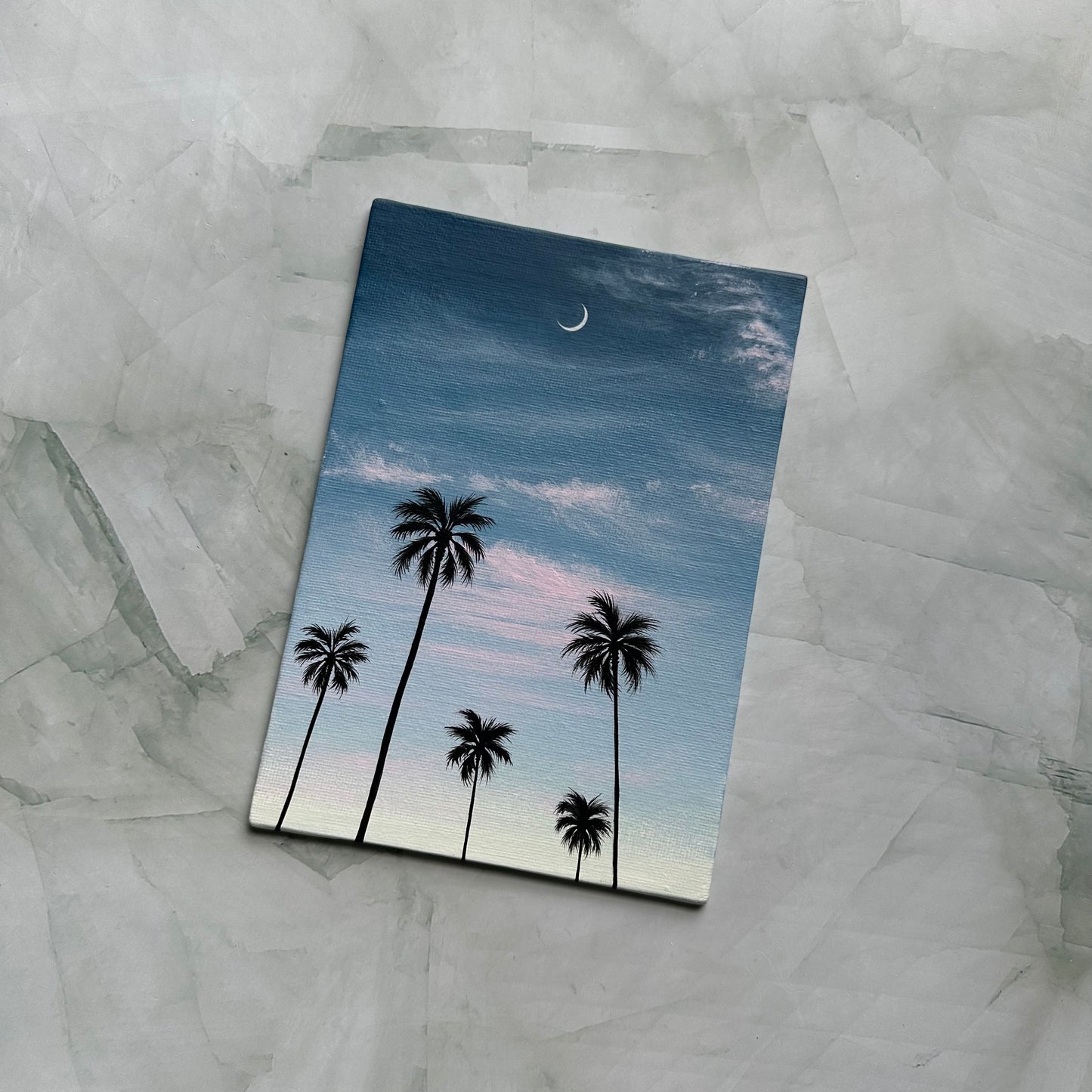 crescent over palms