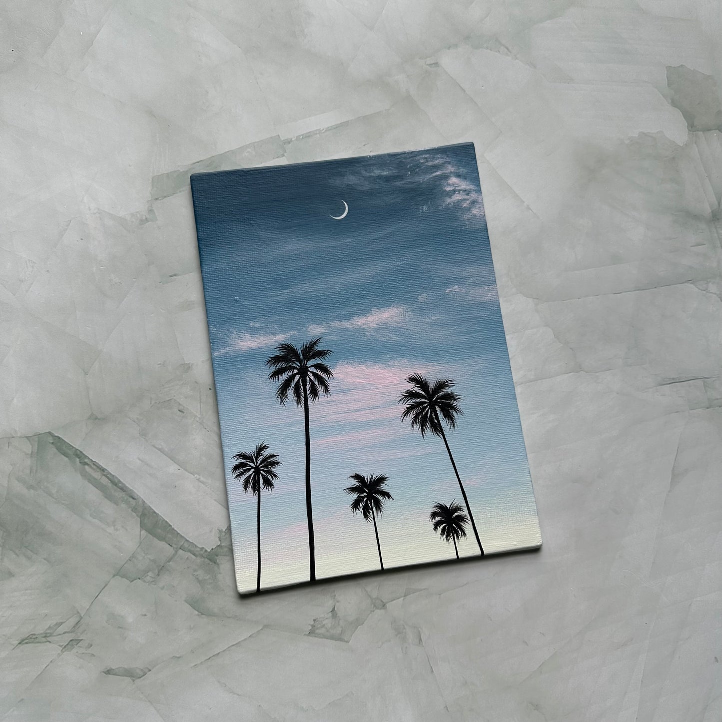 crescent over palms