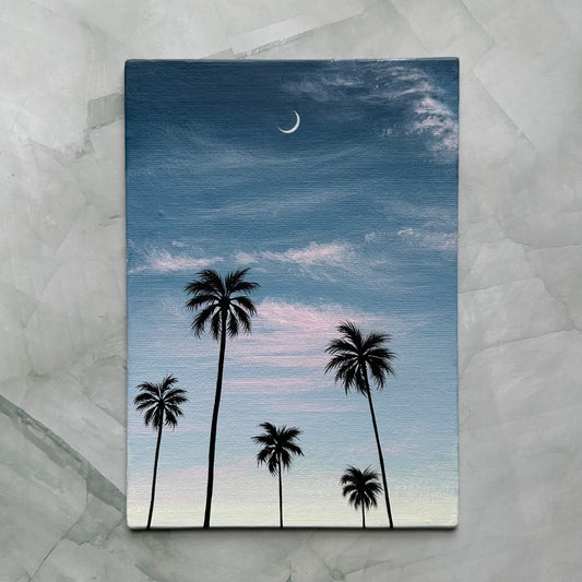 crescent over palms