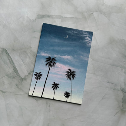 crescent over palms