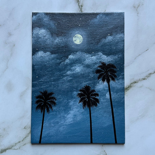 moon over palm trees