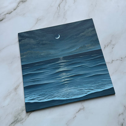 crescent moon over the sea