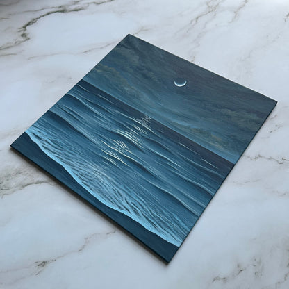 crescent moon over the sea
