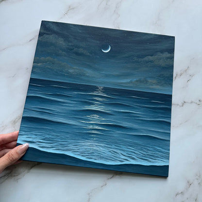 crescent moon over the sea